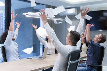 Image showing startup Group of young business people throwing documents