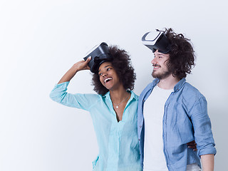 Image showing multiethnic couple getting experience using VR headset glasses