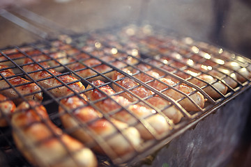 Image showing Grilled sausage with smoke