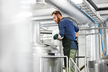 Image showing man working at craft brewery or beer plant