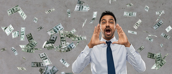 Image showing indian businessman shouting over money rain