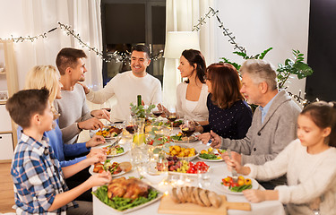 Image showing happy family having dinner party at home