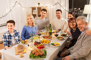 Image showing happy family having dinner party at home