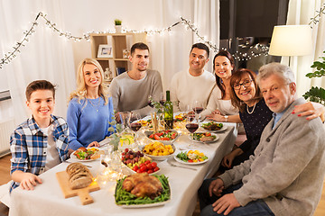 Image showing happy family having dinner party at home