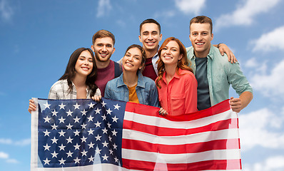 Image showing group of smiling friends with american flag