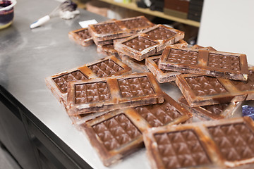 Image showing chocolate in candy molds at confectionery shop