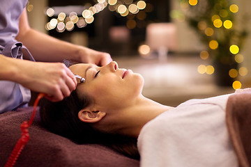 Image showing woman having hydradermie facial treatment in spa