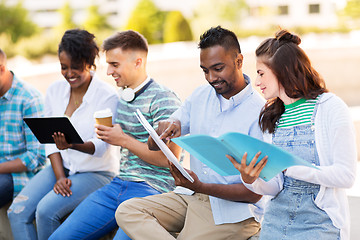 Image showing international students with notebooks outdoors