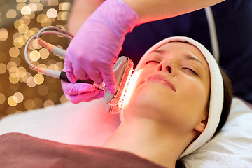 Image showing young woman having face microdermabrasion at spa