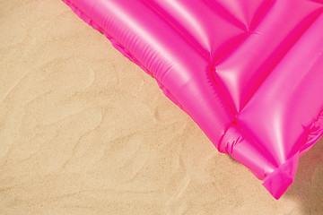 Image showing pink swimming mattress on beach