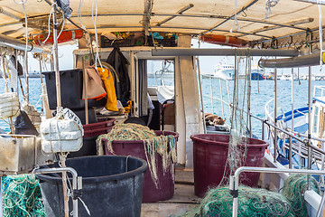 Image showing The fishing boat\'s interior, the right side of the boat, the fishing tools, the fishing industry, the rusting cabin