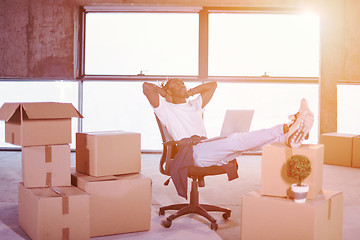 Image showing young black casual businessman taking a break on construction si