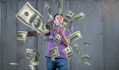 Image showing businessman making the rain of money