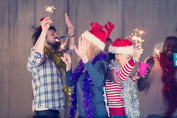 Image showing multiethnic group of casual business people dancing with sparkle