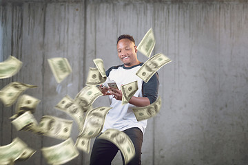 Image showing black businessman making the rain of money