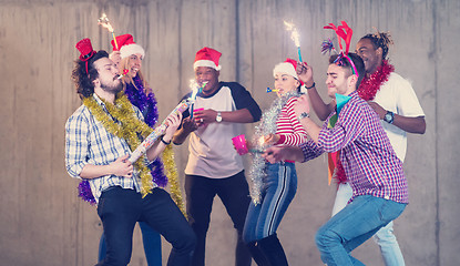 Image showing multiethnic group of casual business people dancing with sparkle