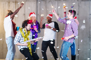 Image showing multiethnic group of casual business people having confetti part