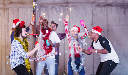 Image showing multiethnic group of casual business people having confetti part