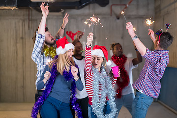 Image showing multiethnic group of casual business people dancing with sparkle