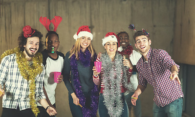 Image showing multiethnic group of casual business people dancing with sparkle