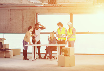 Image showing group of multiethnic business people on construction site