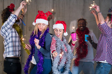 Image showing multiethnic group of casual business people dancing with sparkle