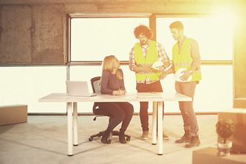 Image showing business people in group on construction site