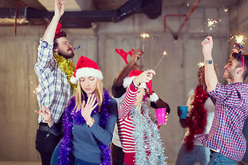 Image showing multiethnic group of casual business people dancing with sparkle