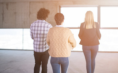 Image showing business team carrying cardboard boxes