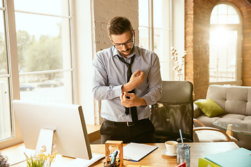 Image showing Young businessman fired, looks upset