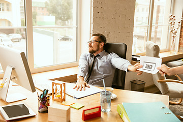 Image showing Young businessman fired, looks upset