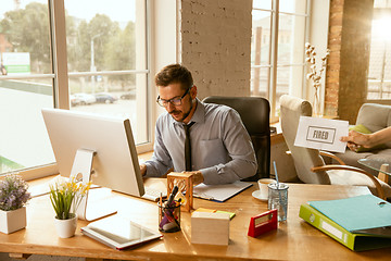 Image showing Young businessman fired, looks upset