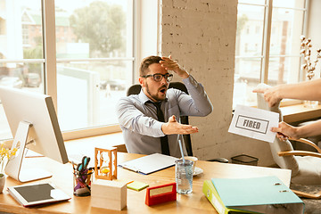 Image showing Young businessman fired, looks upset