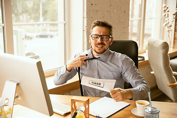 Image showing Young businessman fired, looks upset