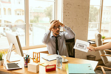 Image showing Young businessman fired, looks upset