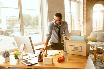 Image showing Young businessman fired, looks upset