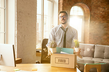 Image showing Young businessman fired, looks upset