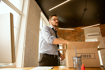 Image showing Young businessman fired, looks upset