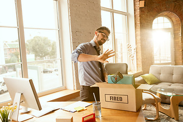 Image showing Young businessman fired, looks upset