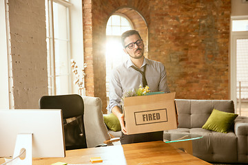 Image showing Young businessman fired, looks upset