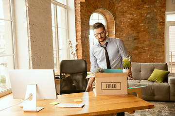 Image showing Young businessman fired, looks upset