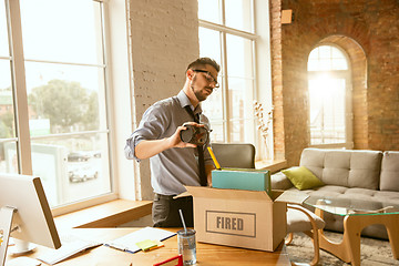 Image showing Young businessman fired, looks upset