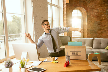 Image showing Young businessman fired, looks upset