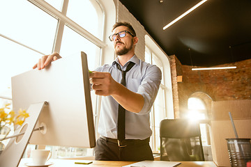 Image showing Young businessman fired, looks upset