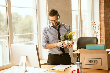 Image showing Young businessman fired, looks upset