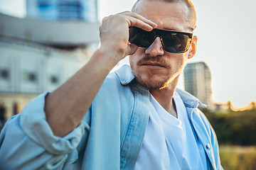 Image showing Young caucasian man, modern shot in film grain effect