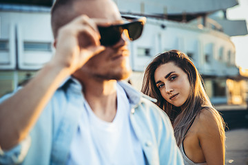 Image showing Tanned young caucasian couple, modern lovestory in film grain effect