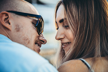 Image showing Tanned young caucasian couple, modern lovestory in film grain effect