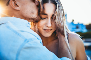 Image showing Tanned young caucasian couple, modern lovestory in film grain effect