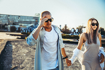 Image showing Tanned young caucasian couple, modern lovestory in film grain effect